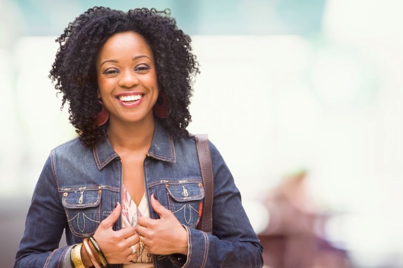 Smiling woman with a healthy, confident smile after tooth-colored dental fillings in Austin