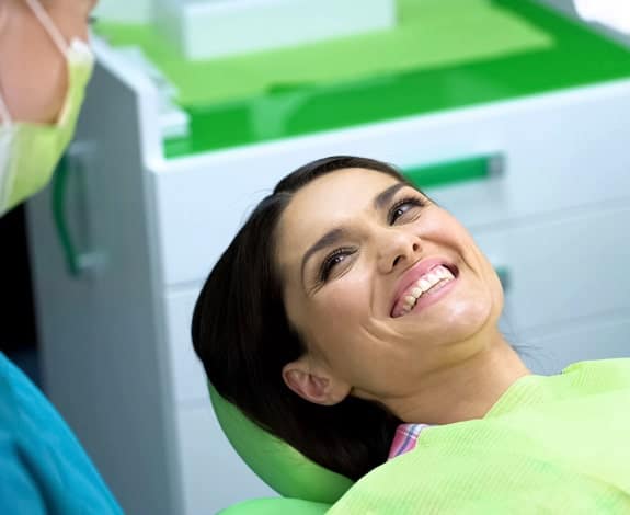 Patient receiving wisdom tooth removal treatment in South Austin dental office during comfortable oral surgery procedure
